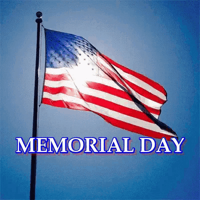 American flag waving in the wind with the text 'MEMORIAL DAY' below it.
