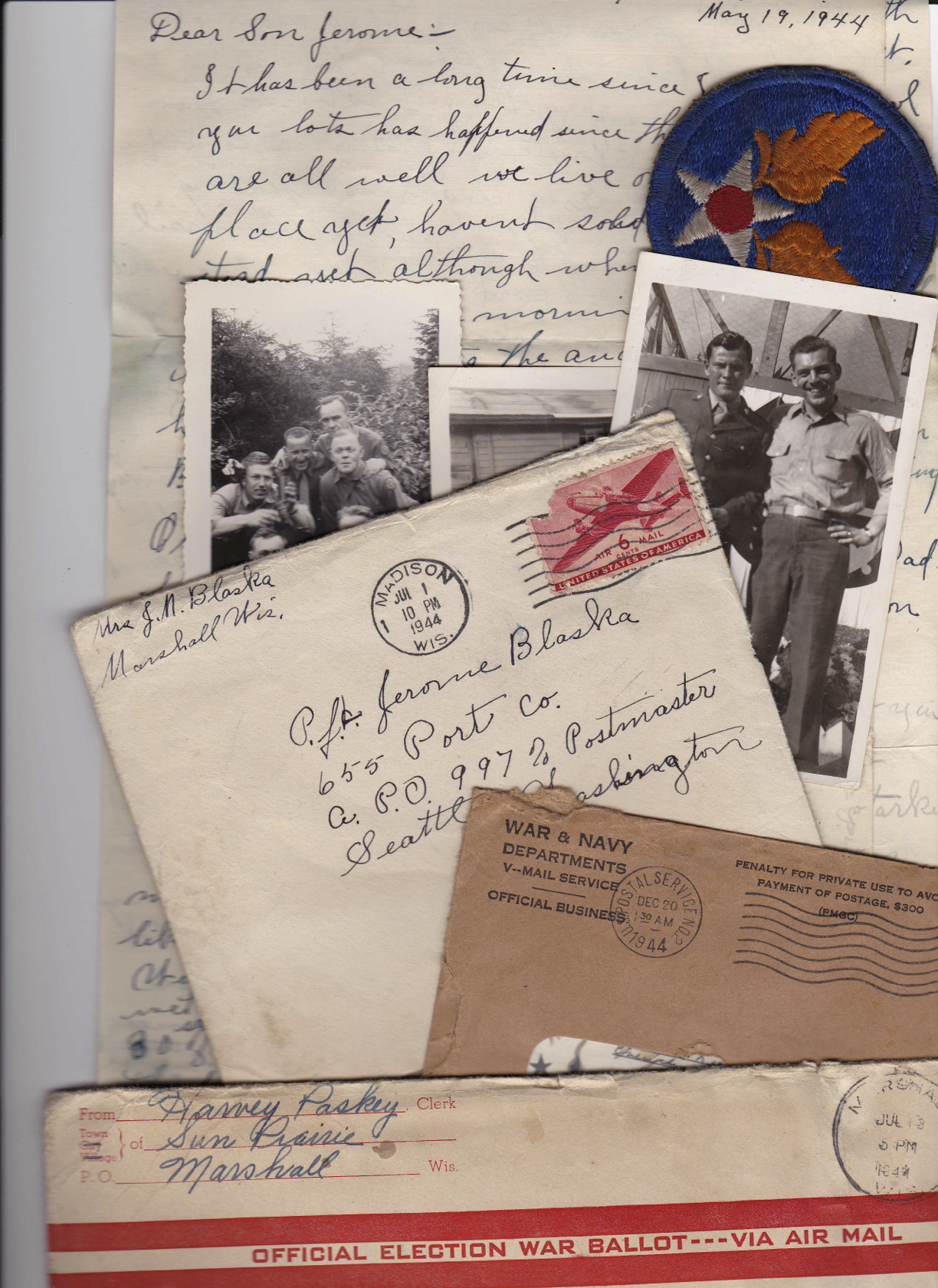A collage of historical letters and photographs, including a handwritten letter dated May 19, 1944, military patches, and envelopes featuring postal markings and election materials from World War II.